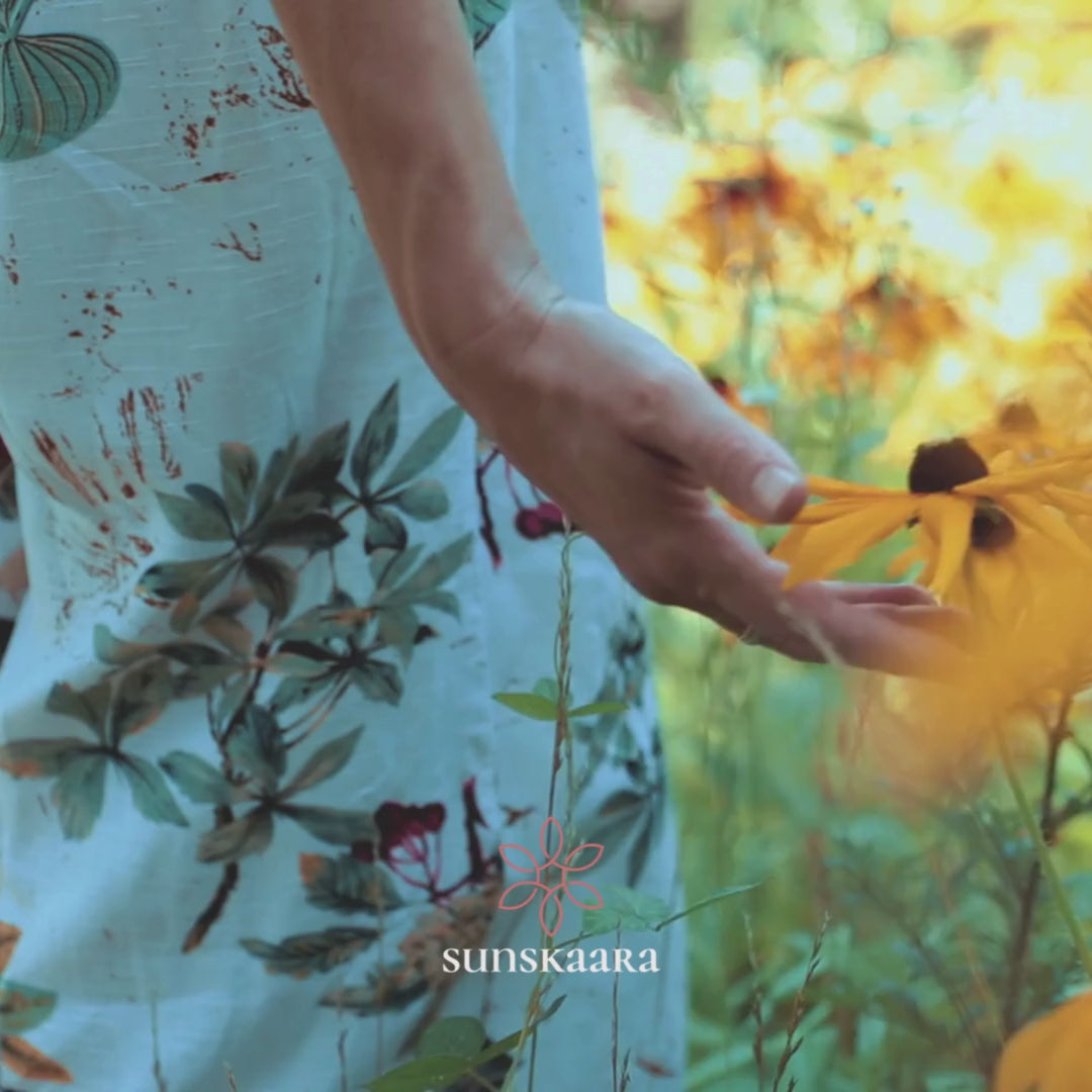 Load video: a hand touching black-eyed susan flower video